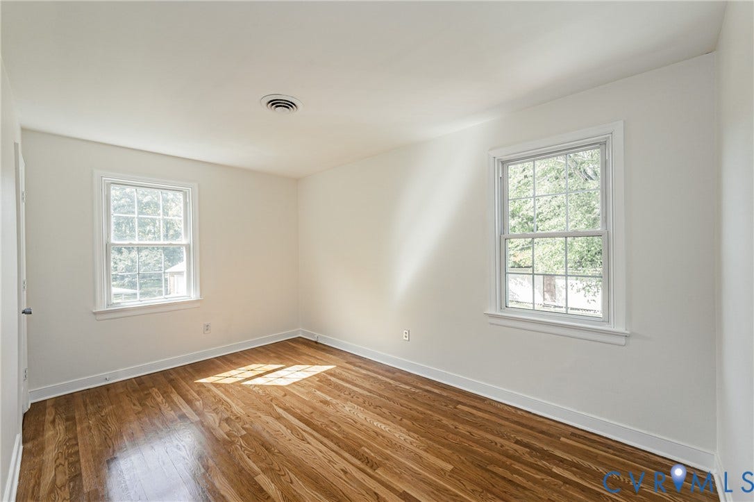 1608 Lochwood Drive, Henrico, VA 23238 Hardwood flooring, white walls, and two double-hung windows
