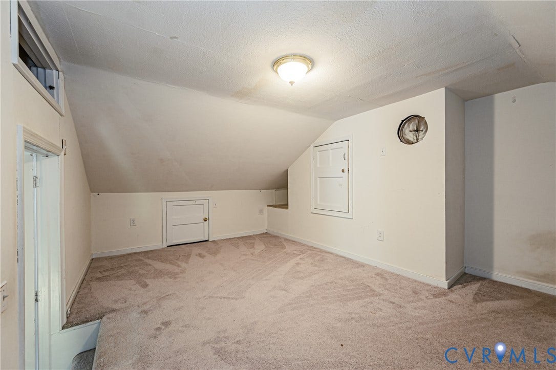 1608 Lochwood Drive, Henrico, VA 23238 Spacious bonus room with sloped ceilings, neutral carpet flooring, and abundant natural light from multiple windows