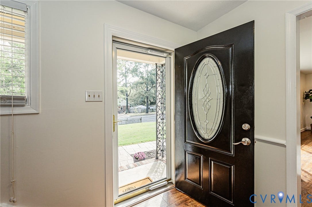 1608 Lochwood Drive, Henrico, VA 23238 Entry with decorative glass door, wood-finish flooring, and natural light from a window with blinds
