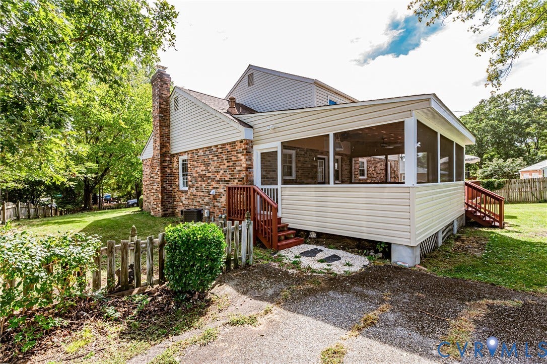 1608 Lochwood Drive, Henrico, VA 23238 Brick exterior with a prominent chimney, screened porch, and side stairs with wood railings