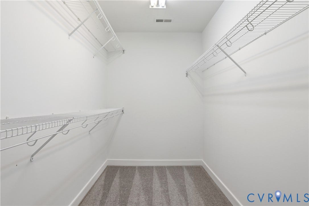 10721 Sheppards Way Drive, Sheppards Way, Glen Allen, VA 23060 Spacious walk-in closet featuring white walls, wire shelving systems along multiple walls, carpeted flooring, and recessed ceiling lighting for optimal storage and visibility