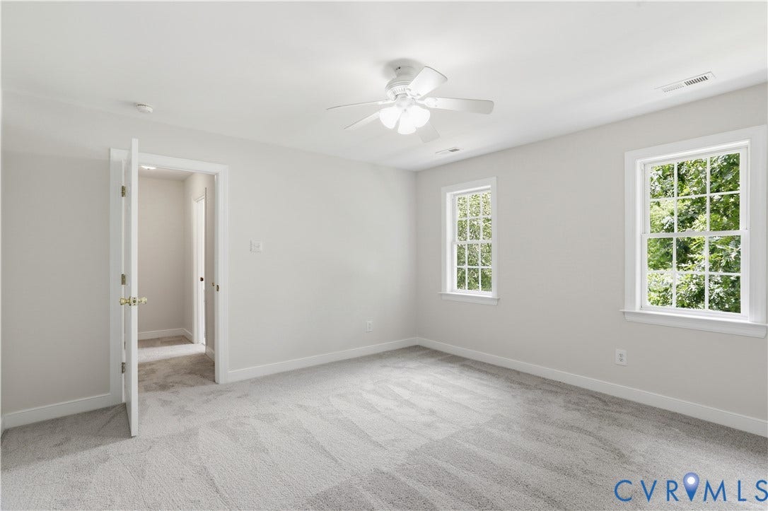 10721 Sheppards Way Drive, Sheppards Way, Glen Allen, VA 23060 Plush carpeting, ceiling fan with integrated lighting, two double-hung windows, and a white interior door