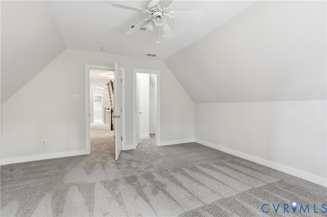 10721 Sheppards Way Drive, Sheppards Way, Glen Allen, VA 23060 Bright attic bedroom featuring vaulted ceilings, ceiling fan, and striped carpet flooring throughout