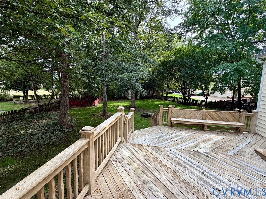 10721 Sheppards Way Drive, Sheppards Way, Glen Allen, VA 23060 Expansive wood deck with built-in bench seating, wood railing, and a slatted privacy fence bordering the property