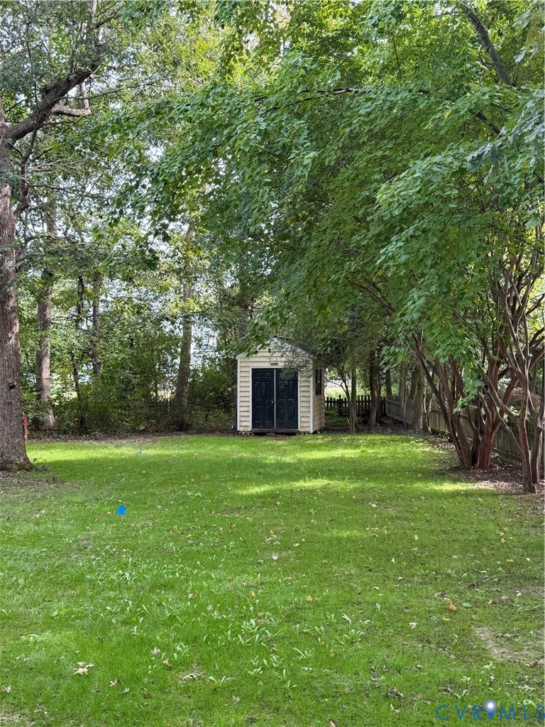 10721 Sheppards Way Drive, Sheppards Way, Glen Allen, VA 23060 Expansive green lawn with mature trees and a storage shed
