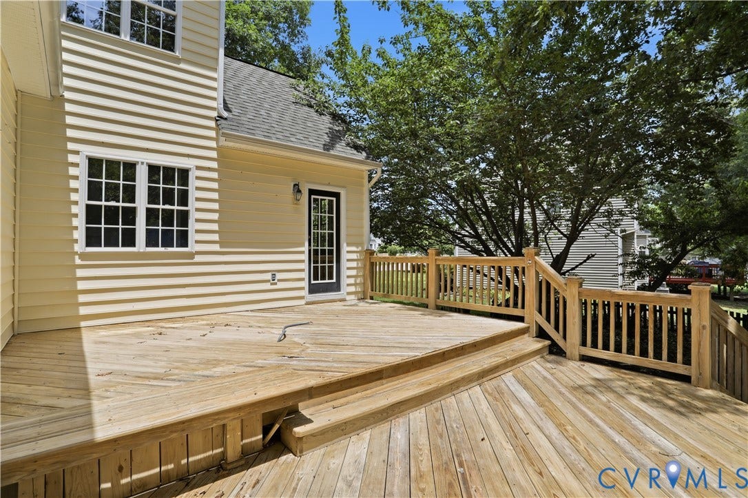 10721 Sheppards Way Drive, Sheppards Way, Glen Allen, VA 23060 Expansive multi-level wood deck featuring a wood railing system, integrated steps, and a rear exterior door