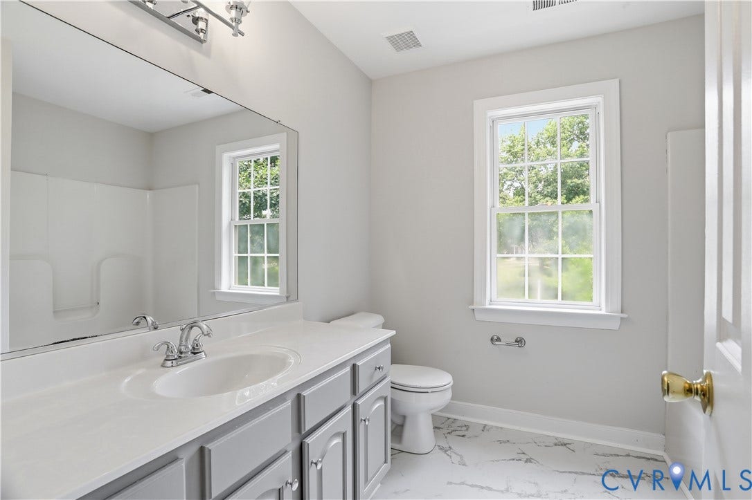 10721 Sheppards Way Drive, Sheppards Way, Glen Allen, VA 23060 White countertop with an integrated sink, gray cabinetry, and a chrome faucet