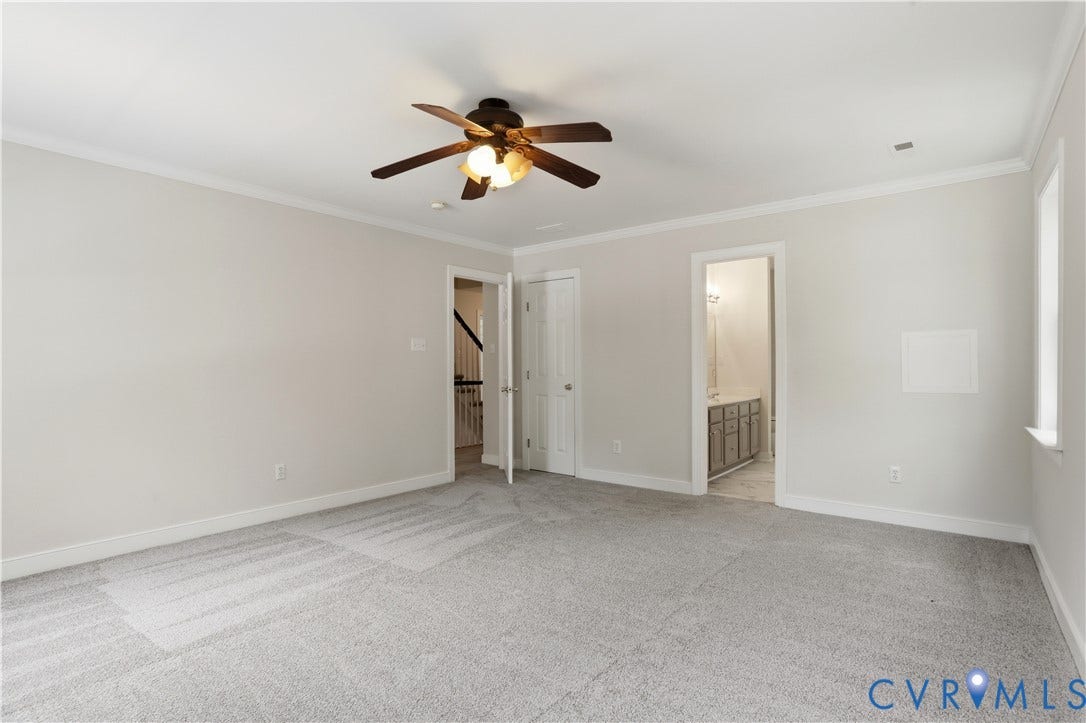 10721 Sheppards Way Drive, Sheppards Way, Glen Allen, VA 23060 Spacious bedroom featuring neutral wall finishes, plush carpeting, a ceiling fan with integrated lighting, and multiple closet access points including built-in shelving