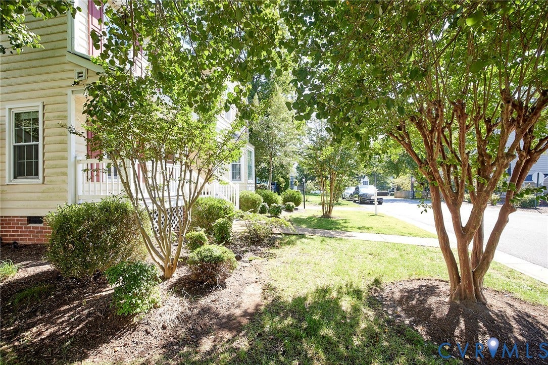 2633 Bradway Lane, Henrico, VA 23233 Mature landscaping with established trees and manicured shrub beds frames this charming home