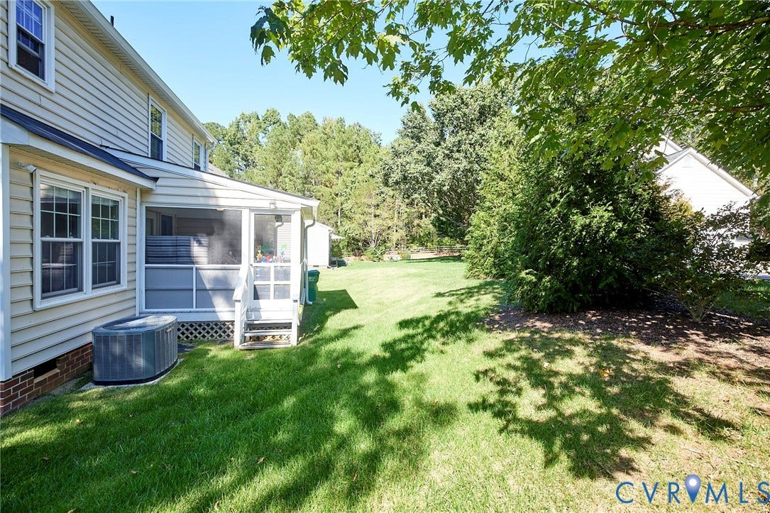 2633 Bradway Lane, Henrico, VA 23233 Screened porch with steps, extended lawn area, and mature trees