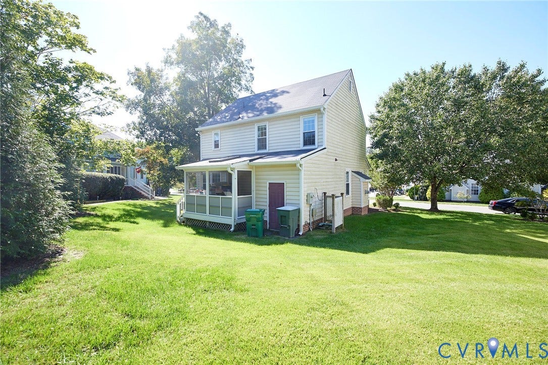 2633 Bradway Lane, Henrico, VA 23233 Classic two-story colonial with screened front porch, positioned on an expansive lawn bordered by mature trees