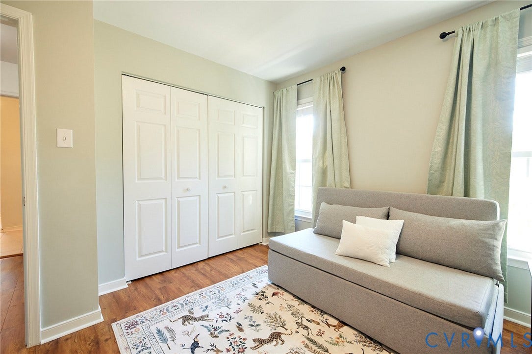 2633 Bradway Lane, Henrico, VA 23233 Wood-finish flooring, two large windows, and a set of bi-fold closet doors