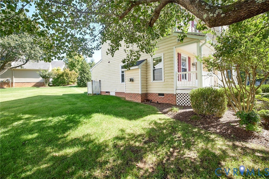 2633 Bradway Lane, Henrico, VA 23233 Charming cottage with brick foundation and covered front porch, set on a spacious lawn shaded by mature trees