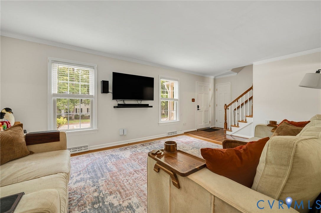 7516 Oakmont Drive, Henrico, VA 23228 Wood-finish flooring, white walls, and crown molding