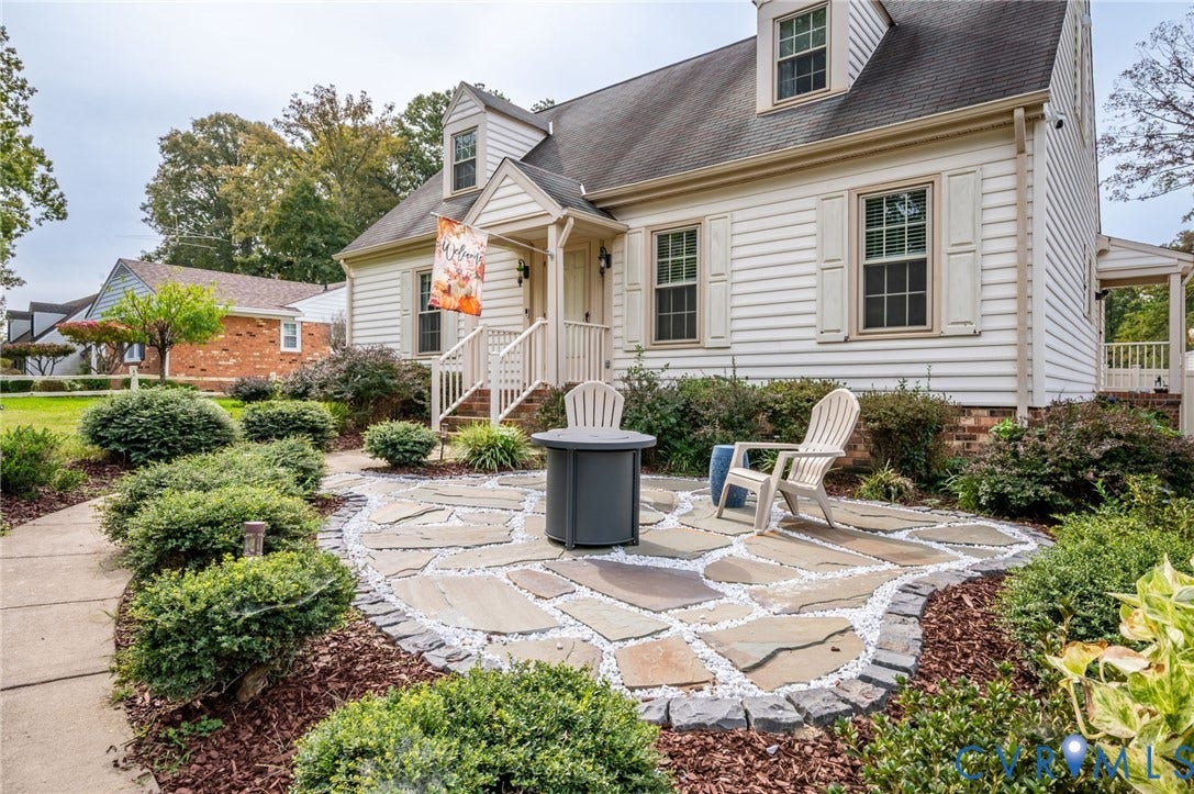 7516 Oakmont Drive, Henrico, VA 23228 Covered entry porch, a flagstone patio with a white gravel border, and established shrubbery