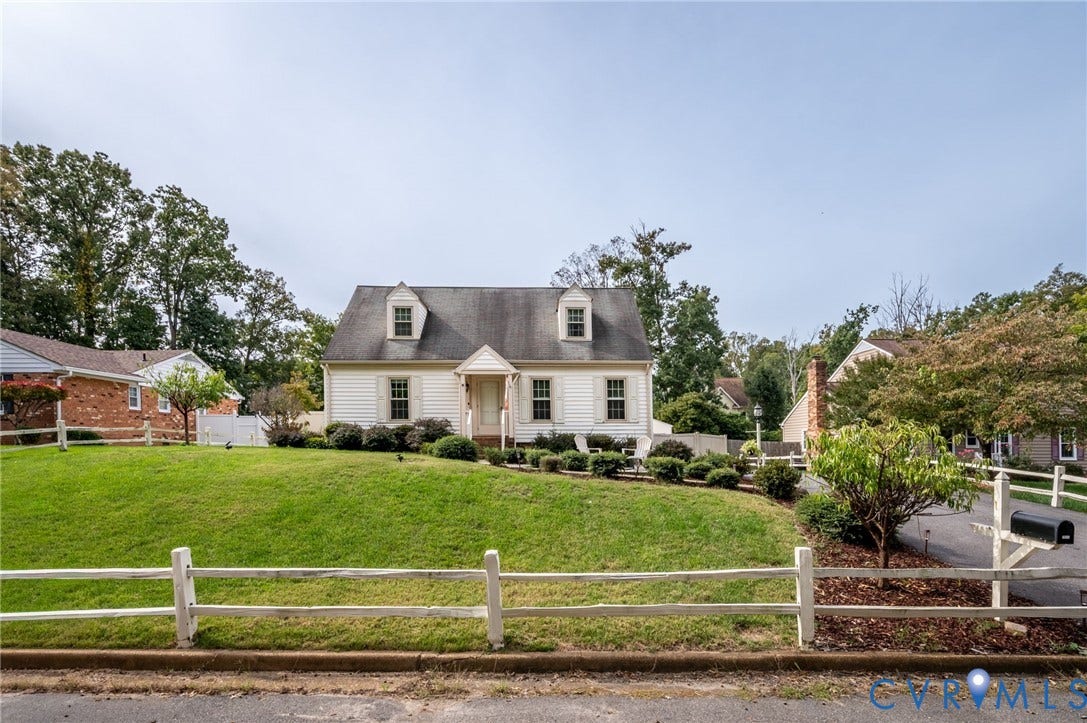7516 Oakmont Drive, Henrico, VA 23228 Siding exterior with a dark shingle roof and two dormer windows
