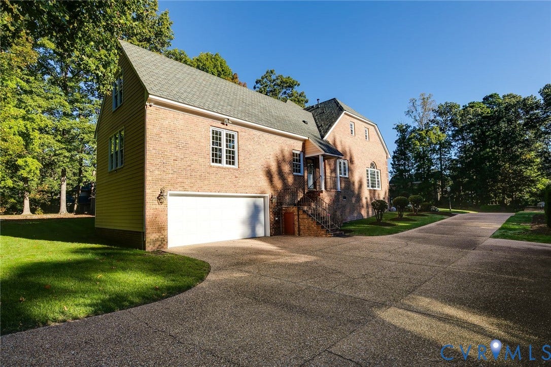 2825 Oak Point Lane, Barrington, Henrico, VA 23233 Double width driveway leads to a two car garage with bonus storage room.