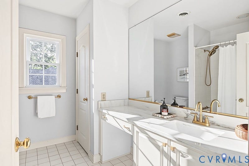2825 Oak Point Lane, Barrington, Henrico, VA 23233 Bedroom 4's full bathroom with new quartz counters, new brass fixtures, linen closet and timeless tile flooring.