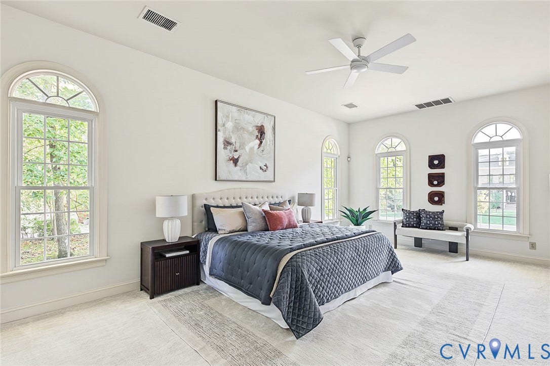 2825 Oak Point Lane, Barrington, Henrico, VA 23233 Luxurious first floor primary with serene palette, two walk in closets and new ceiling fan.