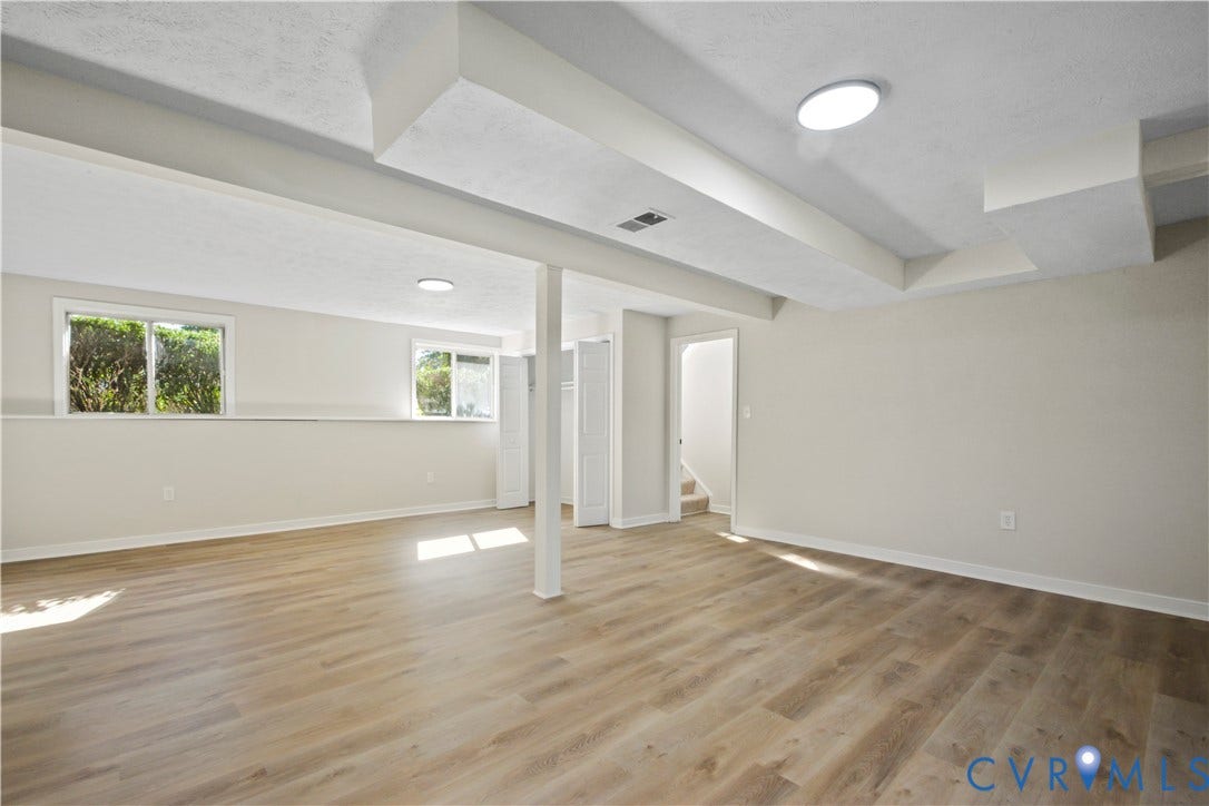 2836 Neale Street, 5-040, Henrico, VA 23223 Spacious room featuring wood-finish flooring, recessed lighting, and multiple windows