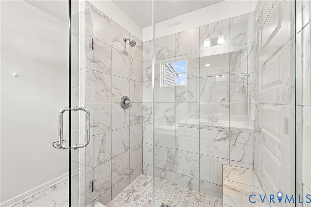 10818 Ashton Poole Place, Henrico, VA 23059 Glass-enclosed shower with marble-finish tile, integrated bench, and mosaic tile flooring