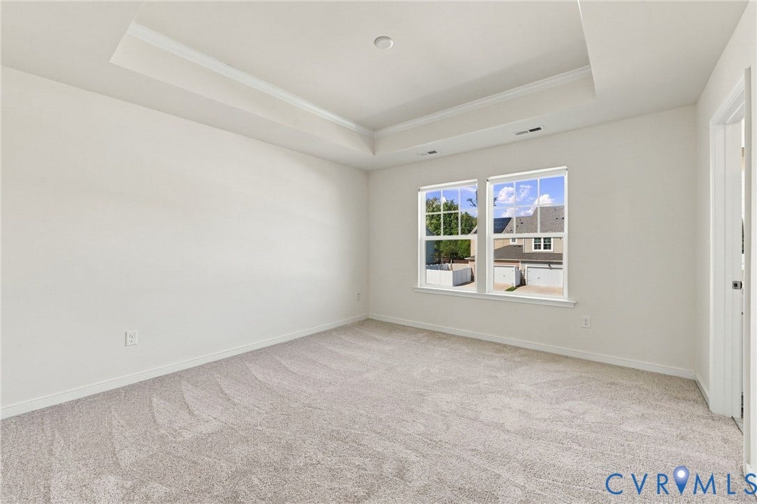 10818 Ashton Poole Place, Henrico, VA 23059 Recessed ceiling with crown molding, light-toned carpeting, two windows, and white trim