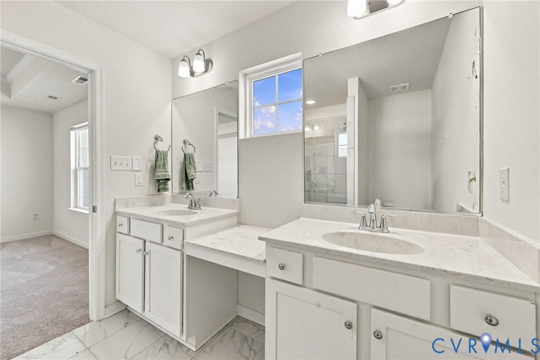 10818 Ashton Poole Place, Henrico, VA 23059 Double vanity with undermount sinks, white cabinetry, integrated dressing area, and tile flooring