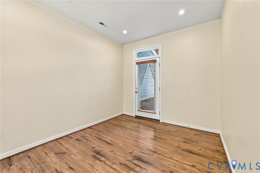 10818 Ashton Poole Place, Henrico, VA 23059 Wood-finish flooring, recessed lighting, and a white door with transom