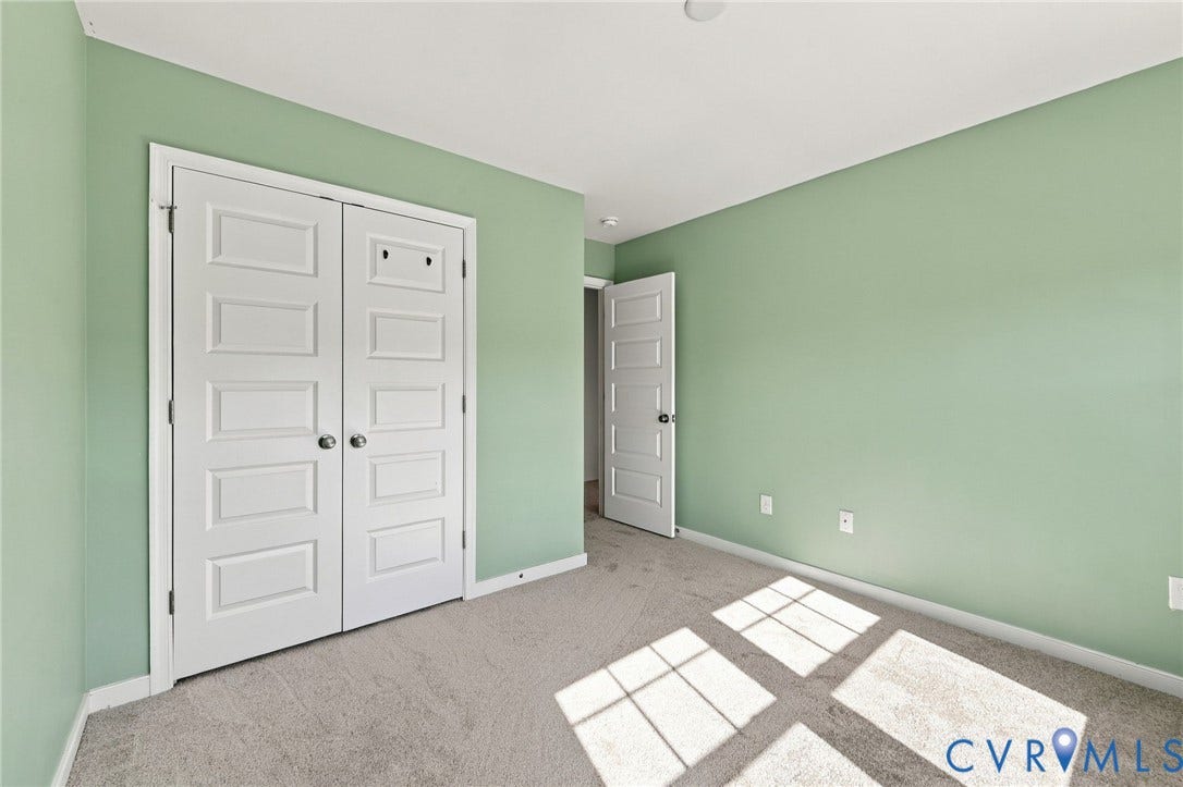 10818 Ashton Poole Place, Henrico, VA 23059 Carpet flooring and a white paneled closet door