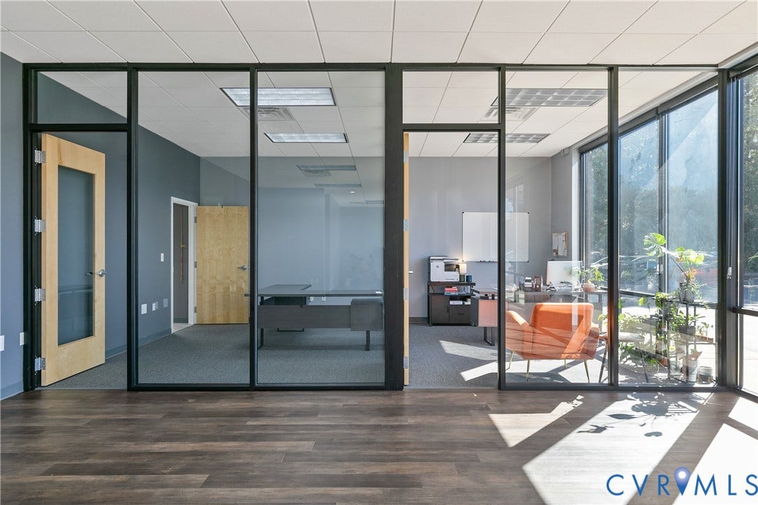 2575 Homeview Drive, Henrico, VA 23294 Wood-finish flooring, full-height glass partitions, drop ceiling with integrated lighting, and commercial-grade carpeting