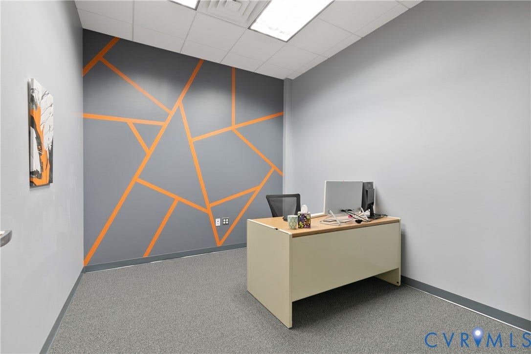 2575 Homeview Drive, Henrico, VA 23294 Textured gray carpeting, light gray walls, and a feature wall with an orange geometric design