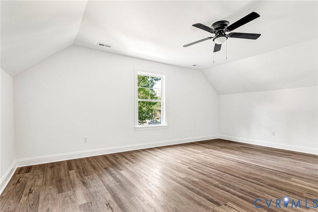 1807 Gordon Avenue, Oak Grove, Oak Grove, VA 23224 Vaulted ceiling, wood-finish flooring, white trim, window with natural light, and ceiling fan with light fixture