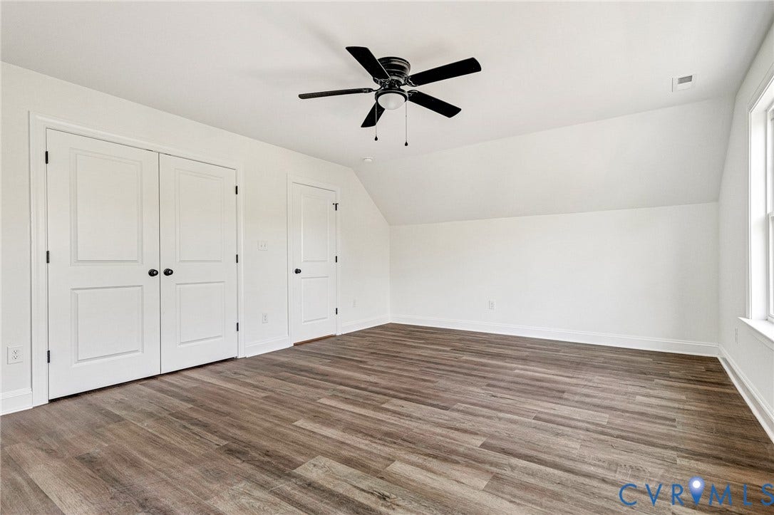 1807 Gordon Avenue, Oak Grove, Oak Grove, VA 23224 Wood-finish flooring, white walls, angled ceiling, ceiling fan, and white trim