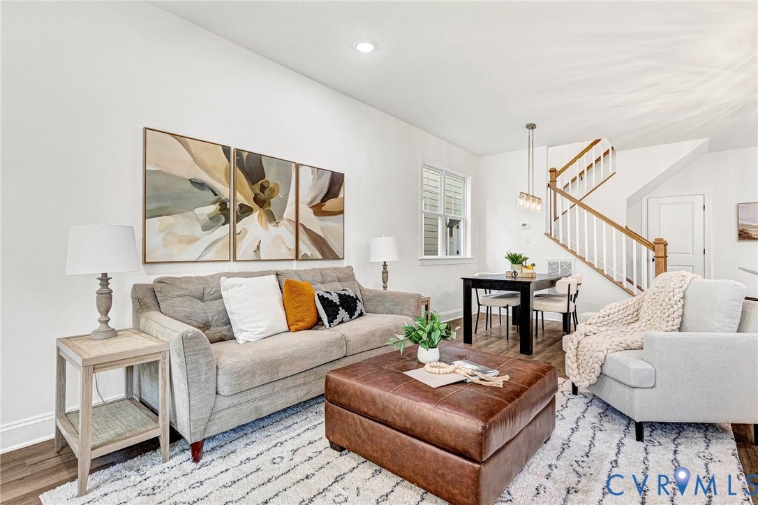1807 Gordon Avenue, Oak Grove, Oak Grove, VA 23224 Open-concept living area featuring wood-finish flooring, recessed lighting, and a prominent staircase with wood handrails and white balusters