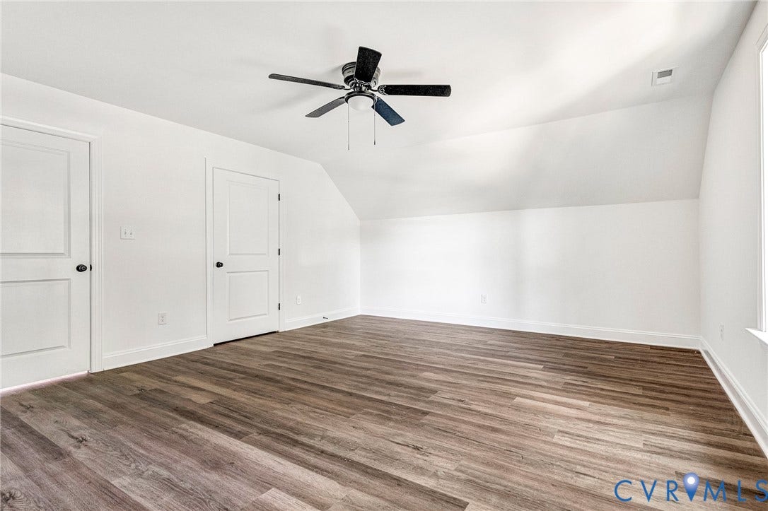 1807 Gordon Avenue, Oak Grove, Oak Grove, VA 23224 Spacious room featuring wood-finish flooring, white walls, and a ceiling fan