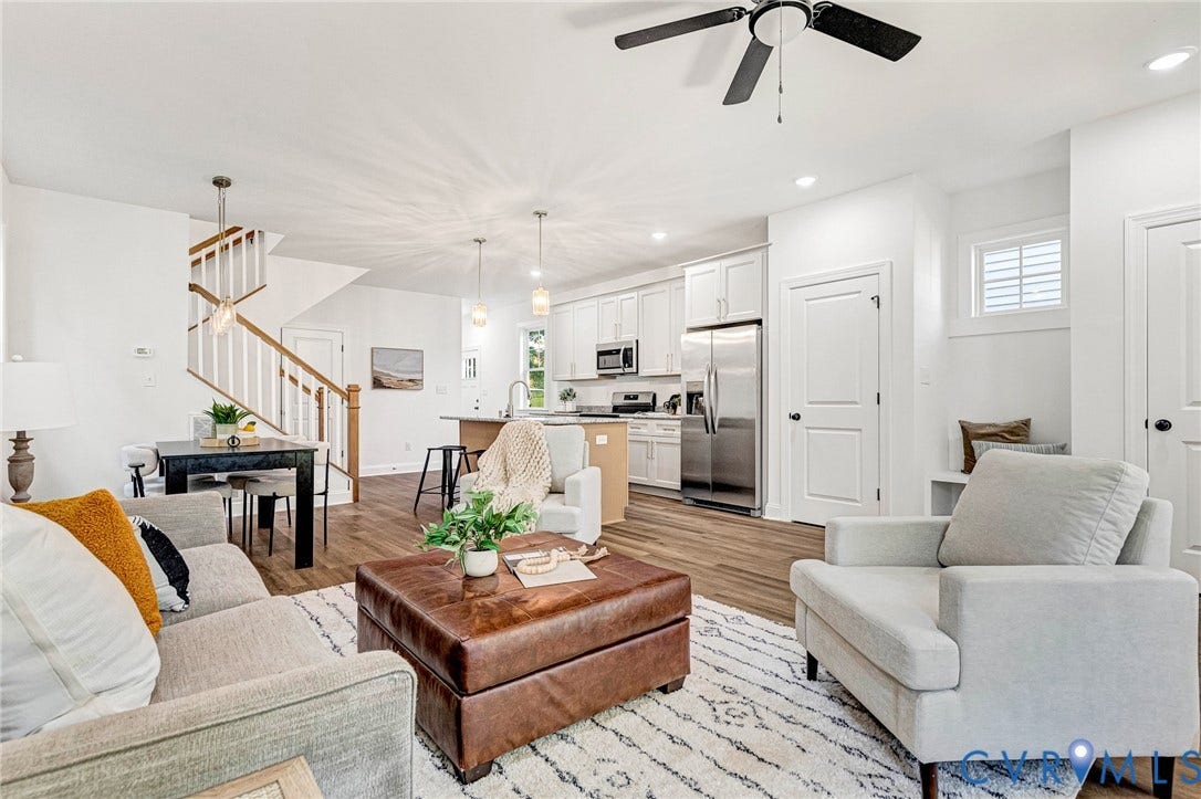 1807 Gordon Avenue, Oak Grove, Oak Grove, VA 23224 Open-concept living area with wood-finish flooring, white walls, and a ceiling fan