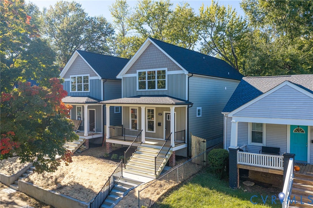 1807 Gordon Avenue, Oak Grove, Oak Grove, VA 23224 Newly constructed residences featuring gabled roofs, siding exteriors, front porches, and extensive exterior stairs