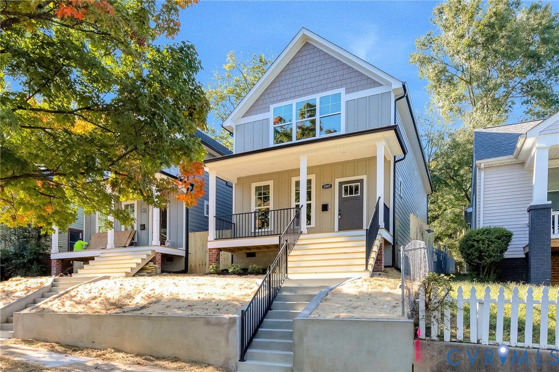 1807 Gordon Avenue, Oak Grove, Oak Grove, VA 23224 Modern Craftsman-style exterior featuring a covered front porch, vertical and horizontal siding, decorative shingle accents, and a dark entry door with frosted glass inserts