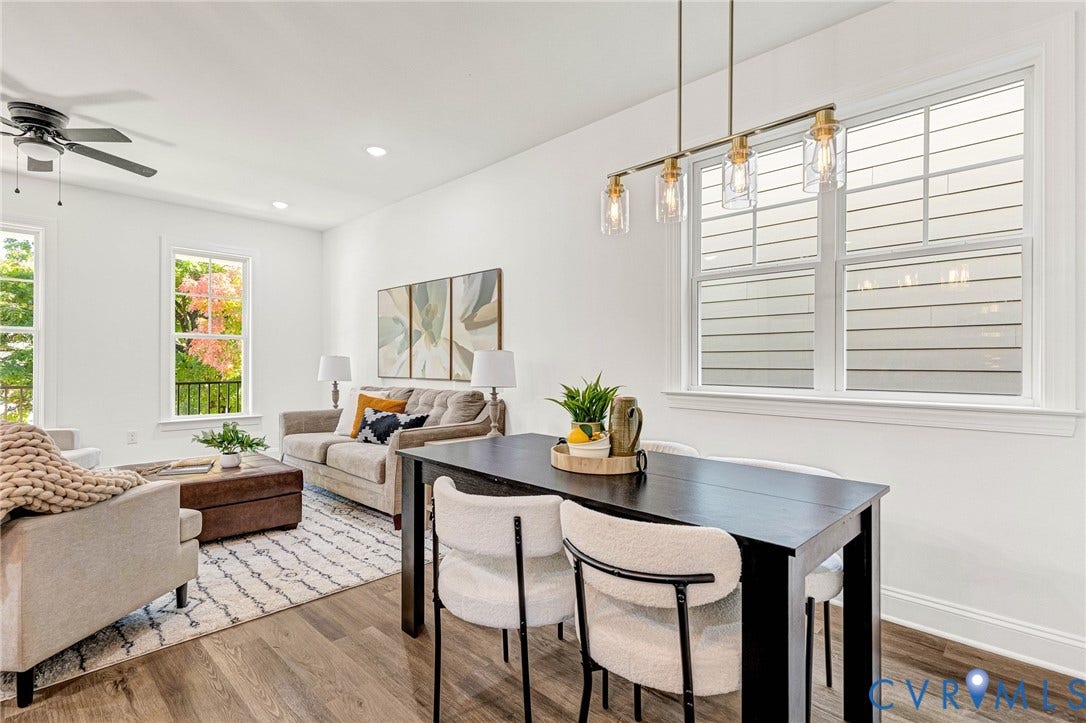 1807 Gordon Avenue, Oak Grove, Oak Grove, VA 23224 Open-concept living and dining area featuring wood-finish flooring, recessed lighting, and a linear pendant light fixture
