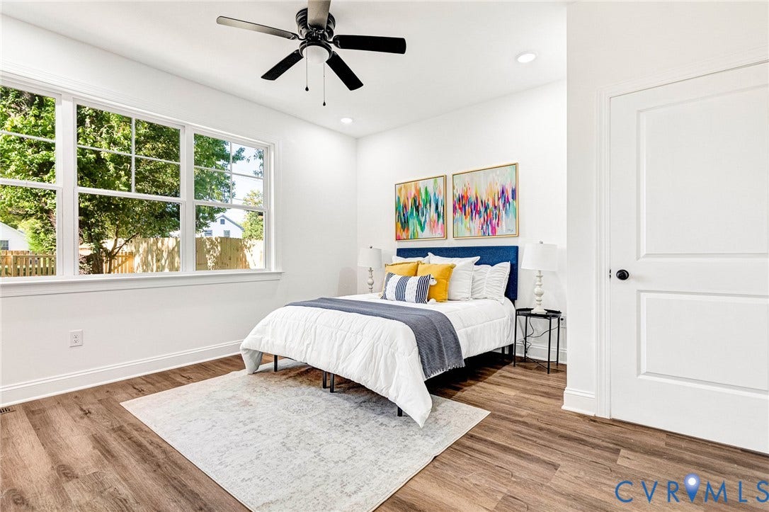 1807 Gordon Avenue, Oak Grove, Oak Grove, VA 23224 Recessed lighting, wood-finish flooring, ceiling fan, multiple windows with white trim, and a paneled white door with black hardware