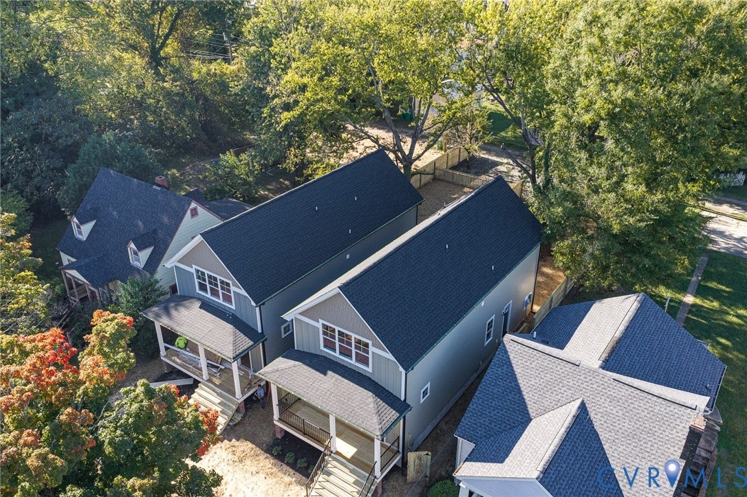 1807 Gordon Avenue, Oak Grove, Oak Grove, VA 23224 Newly constructed residential architecture featuring dark shingle roofing, light-toned siding, and covered front porches with railings