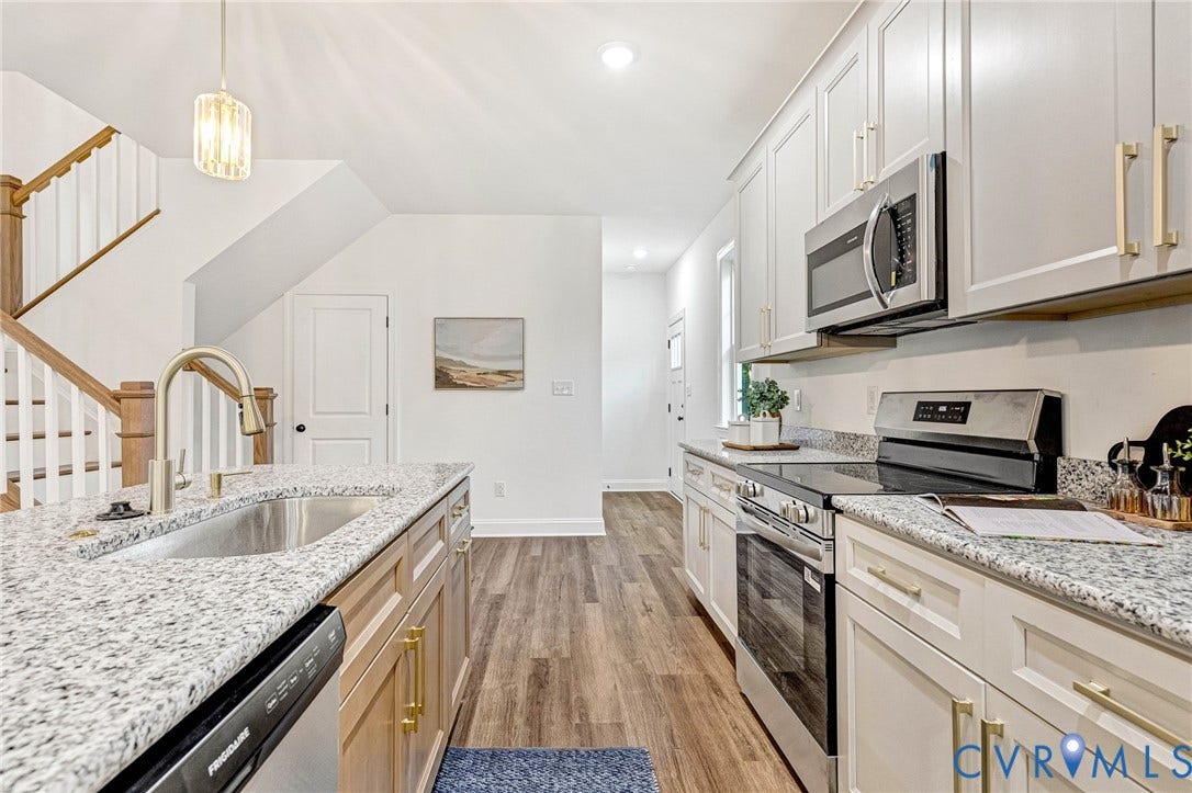 1807 Gordon Avenue, Oak Grove, Oak Grove, VA 23224 Kitchen featuring granite countertops, wood-finish flooring, stainless steel appliances, and white cabinetry with gold-tone hardware