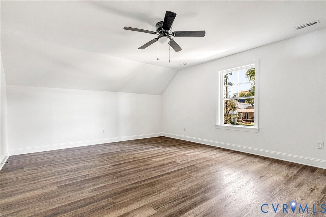 1807 Gordon Avenue, Oak Grove, Oak Grove, VA 23224 Spacious interior with wood-finish flooring, crisp white walls, and a ceiling fan