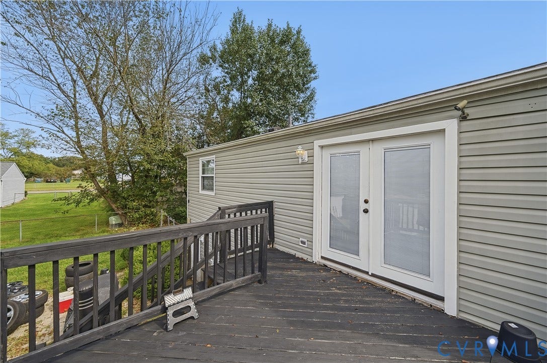 Exterior deck featuring wood railing and dark wood-finish decking