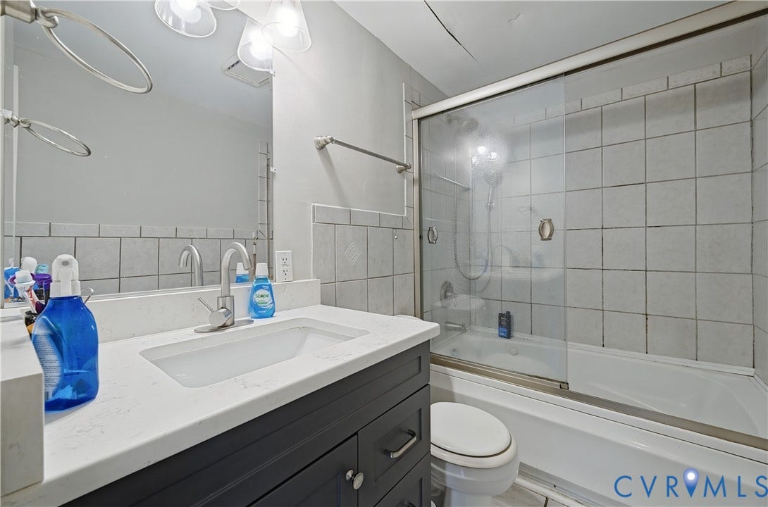 Vanity with integrated sink and chrome faucet