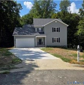 2930 Hog Back Road, Prince George, VA 23860 Two-story residence with a light gray facade, a dark gray shingle roof, and an attached two-car garage