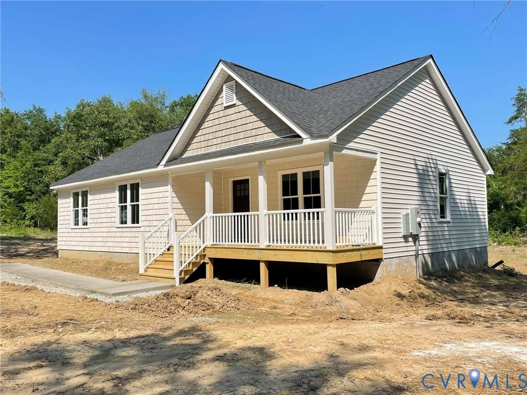tbd Langhorne Road, Langhorne, Cumberland, VA 23040 Charming exterior featuring horizontal siding, decorative shake siding, a covered porch with white railings, and a dark shingle roof