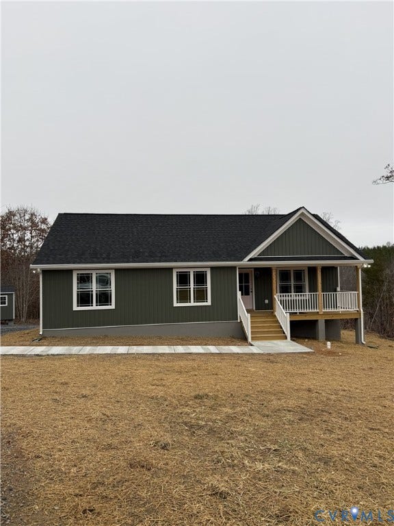 tbd Langhorne Road, Langhorne, Cumberland, VA 23040 Green vertical siding exterior with white trim, a covered front porch, and a dark shingle roof