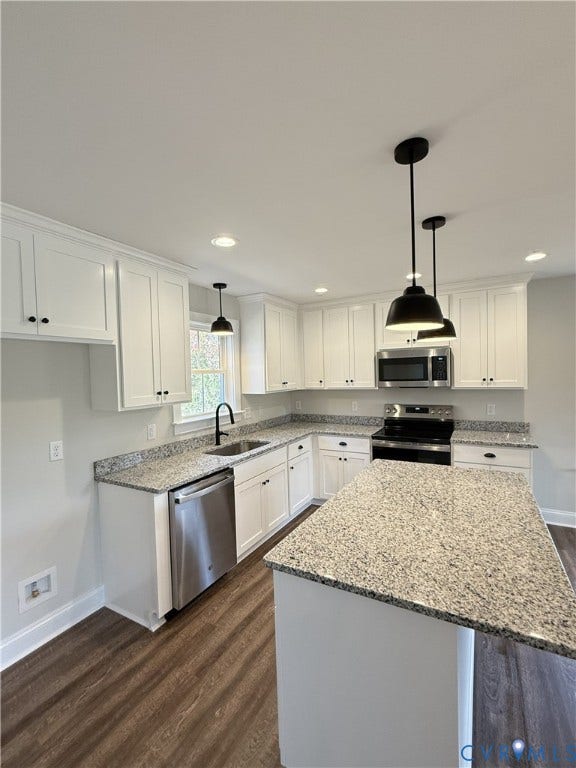 tbd Langhorne Road, Langhorne, Cumberland, VA 23040 Kitchen featuring white cabinetry, light-toned granite countertops, stainless steel appliances, wood-finish flooring, and pendant lighting