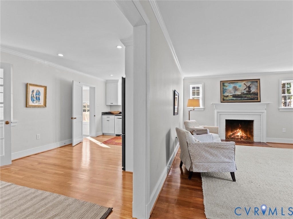 Hardwood flooring throughout, recessed lighting, and white trim